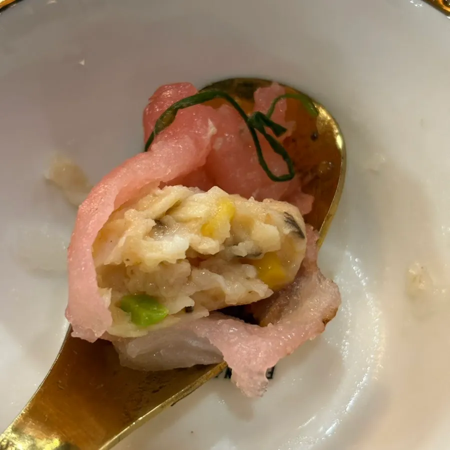Close-up of wedding shaomai topped with corn
