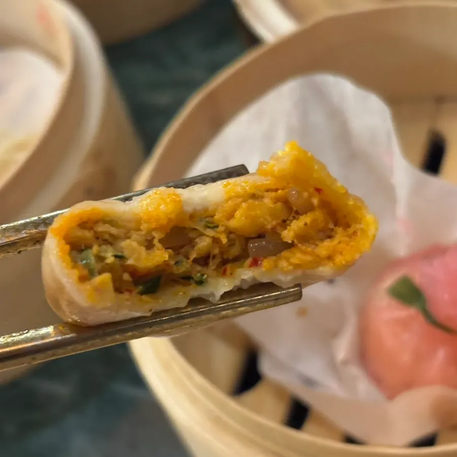 Kimchi xiaolongbao in a steamer basket