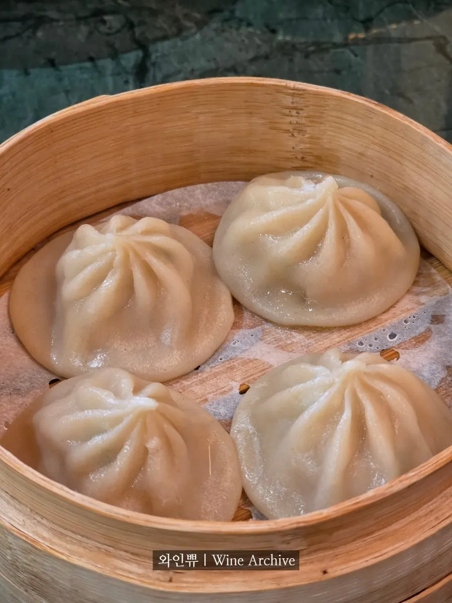 A plate of the handmade dim sum sampler, 4 pieces