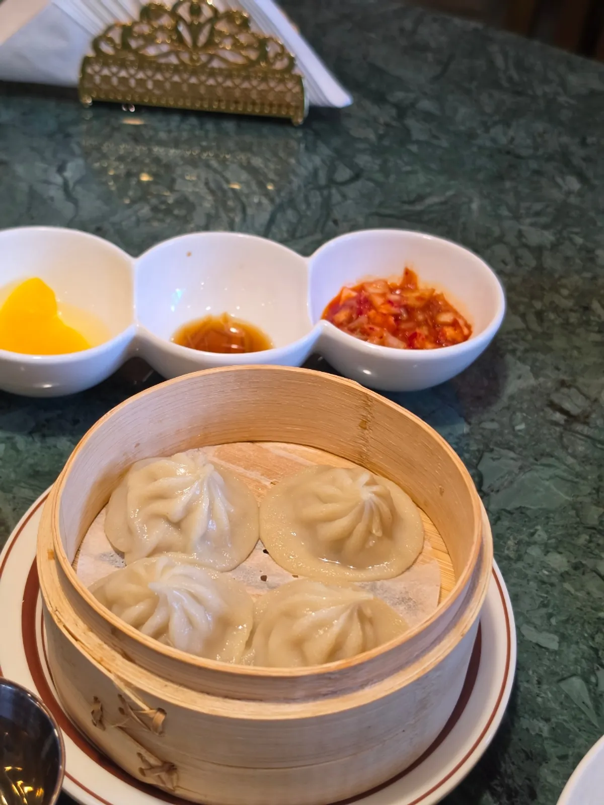 Handmade xiaolongbao, 2pcs, in a bamboo steamer