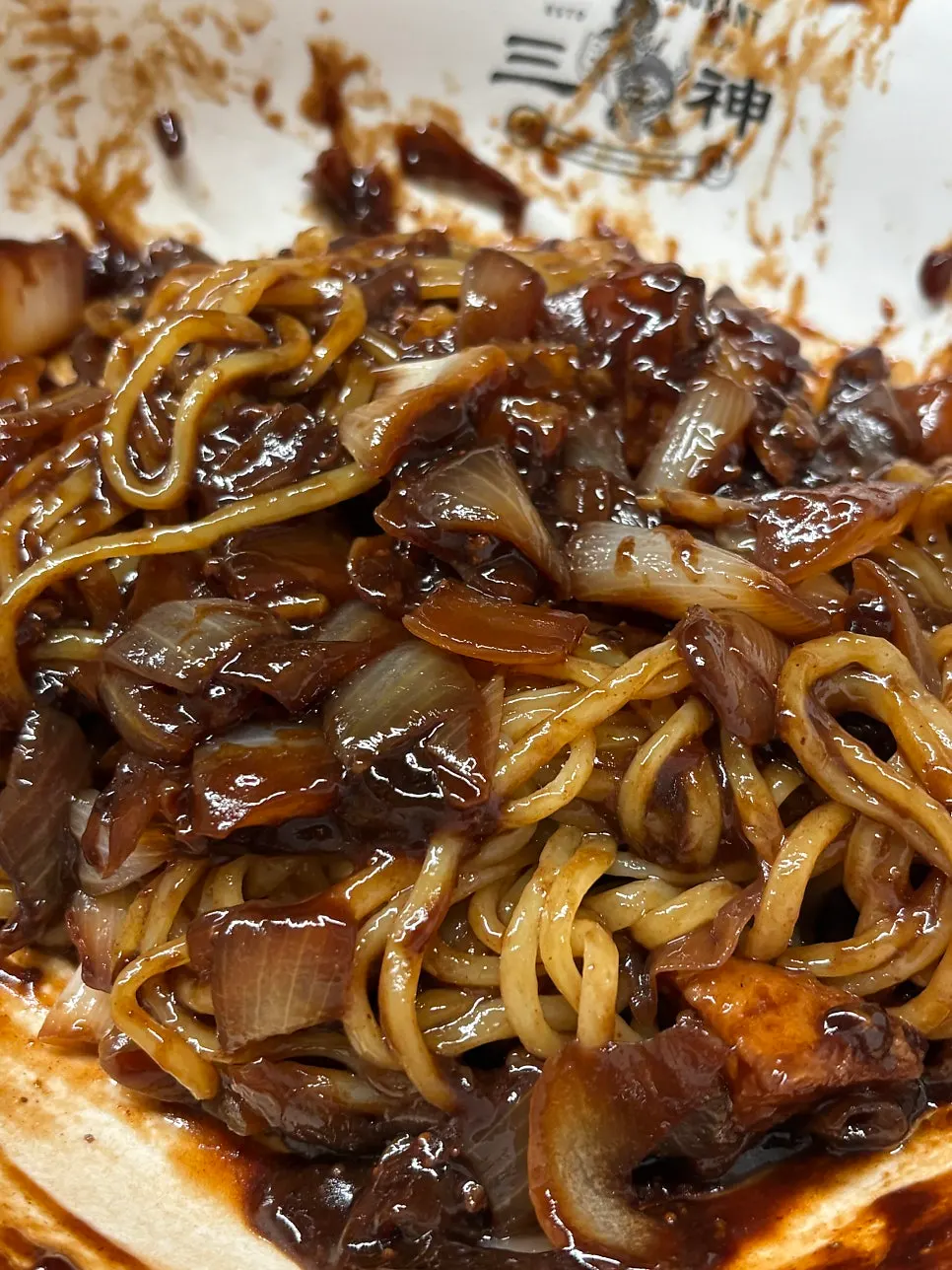 Rich black bean sauce with visible potato pieces