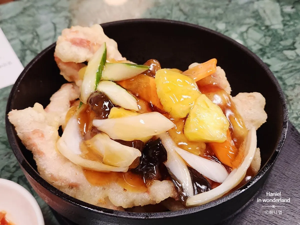 Tokyo tangsuyuk on a stone plate before the sauce is poured