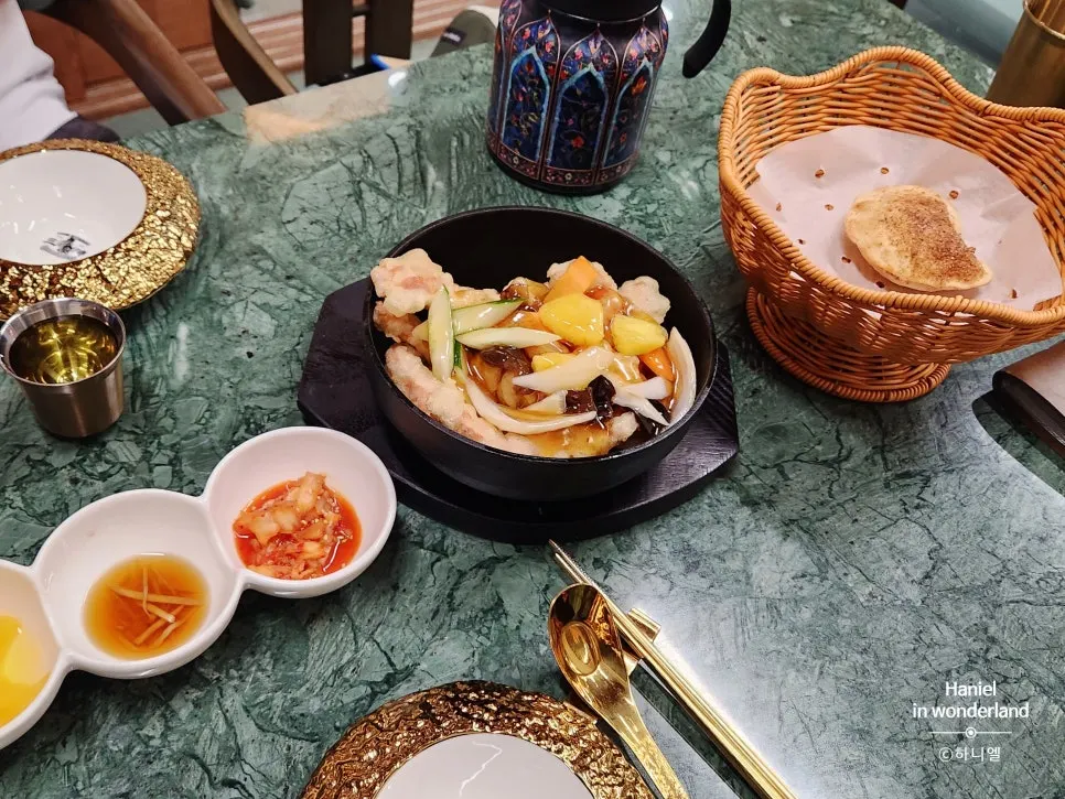 A table spread of dishes at Samsin Garosu-gil