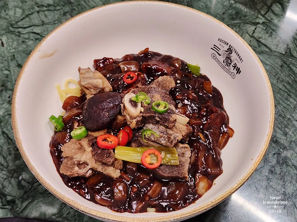 Tender braised short ribs on top of jajangmyeon