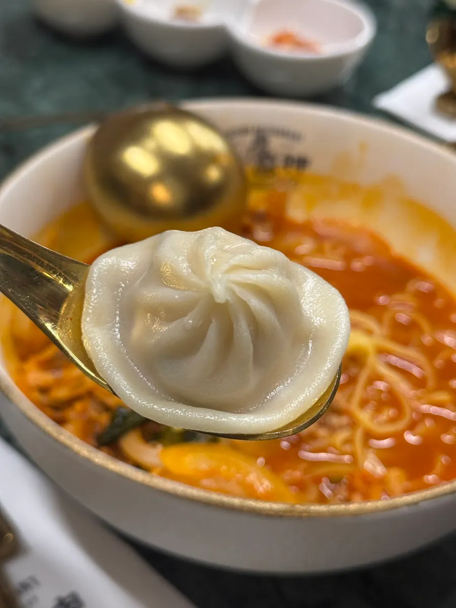 Handmade xiaolongbao served in a steamer