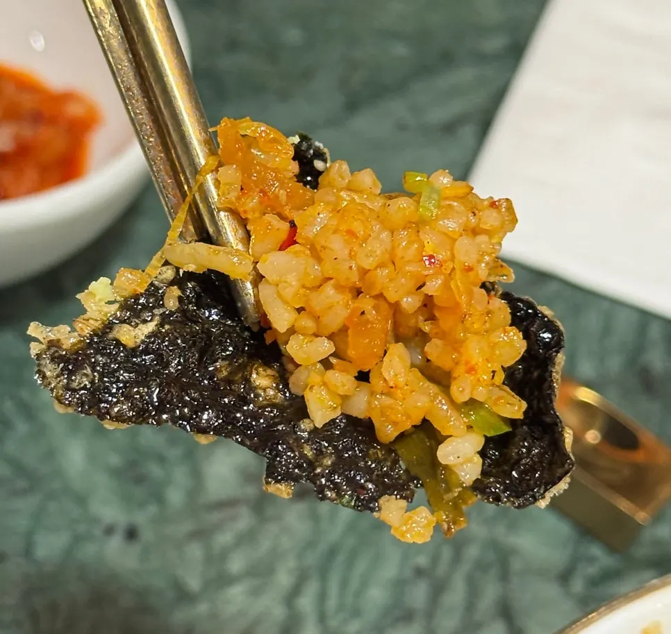 Spicy jjamppong broth served alongside the fried rice