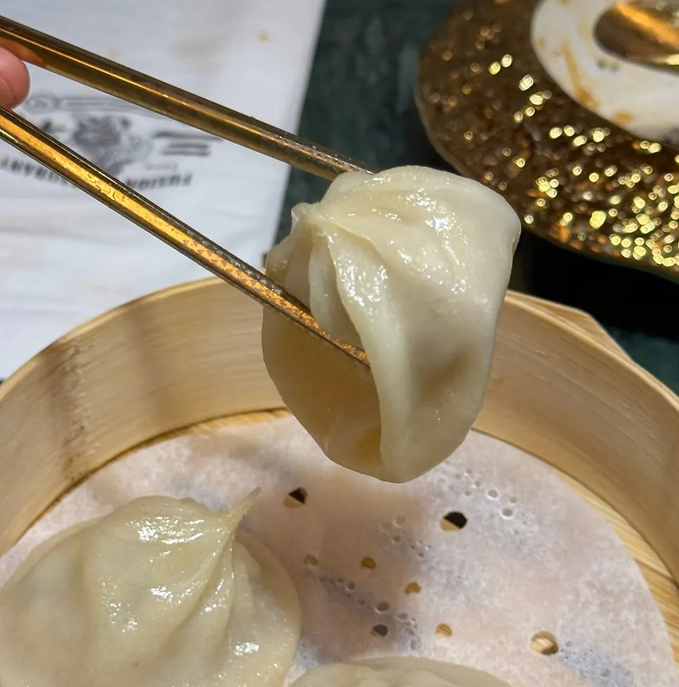 Xiaolongbao served in a steamer basket
