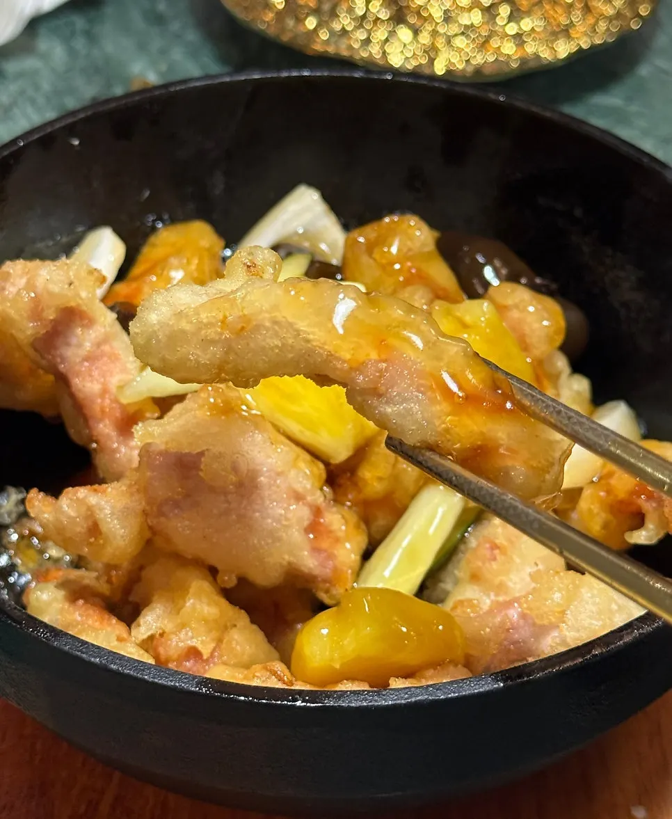 Tokyo tangsuyuk sizzling in a stone pot