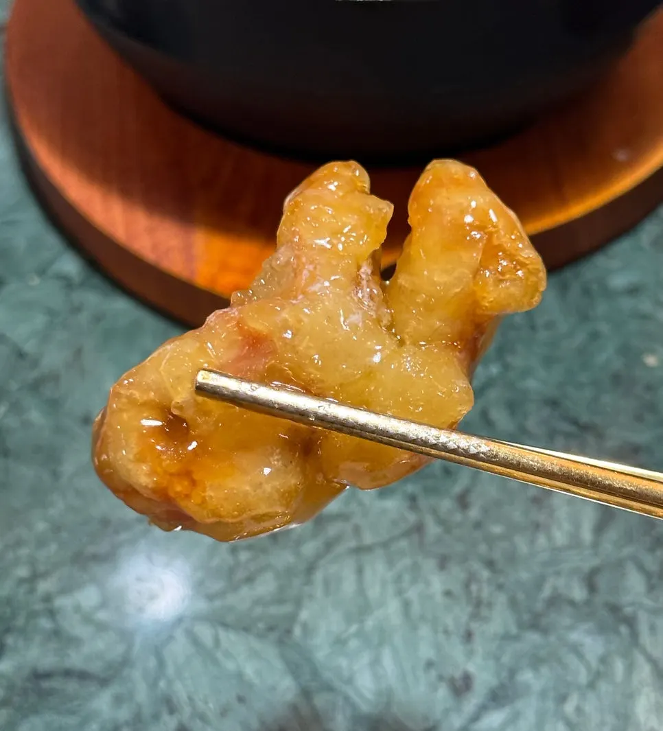 The moment the sauce is poured over Tokyo tangsuyuk