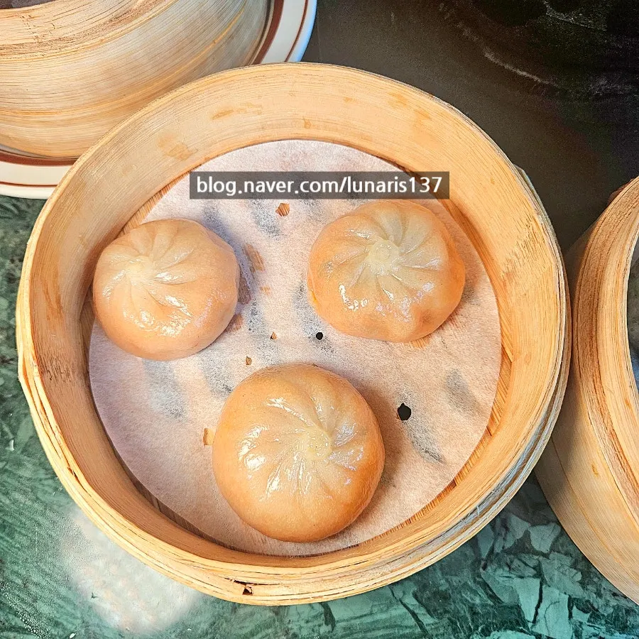 A plate of kimchi xiaolongbao