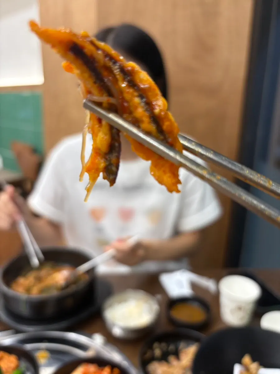 Beef jeon placed on top of bibim naengmyeon