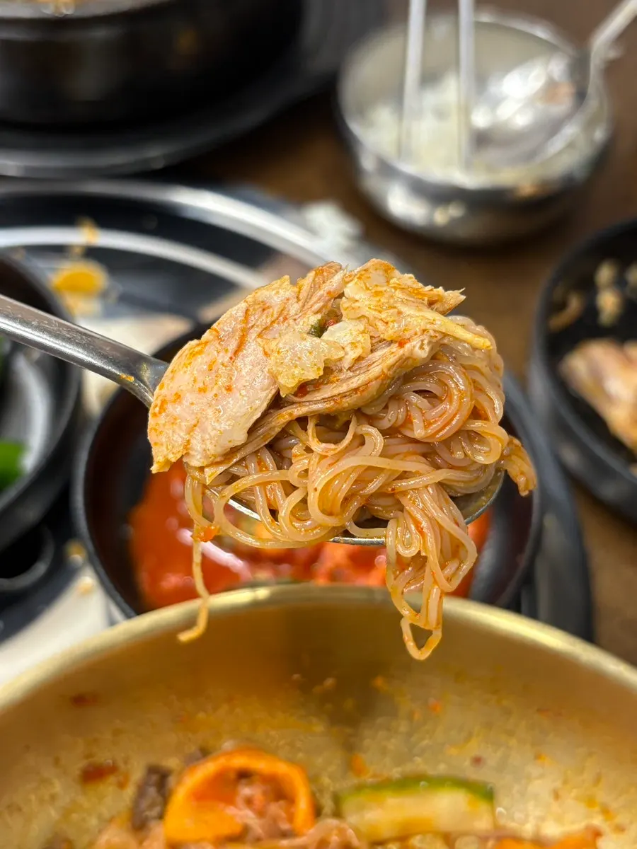 Naengmyeon topped with both beef jeon and gamjatang meat