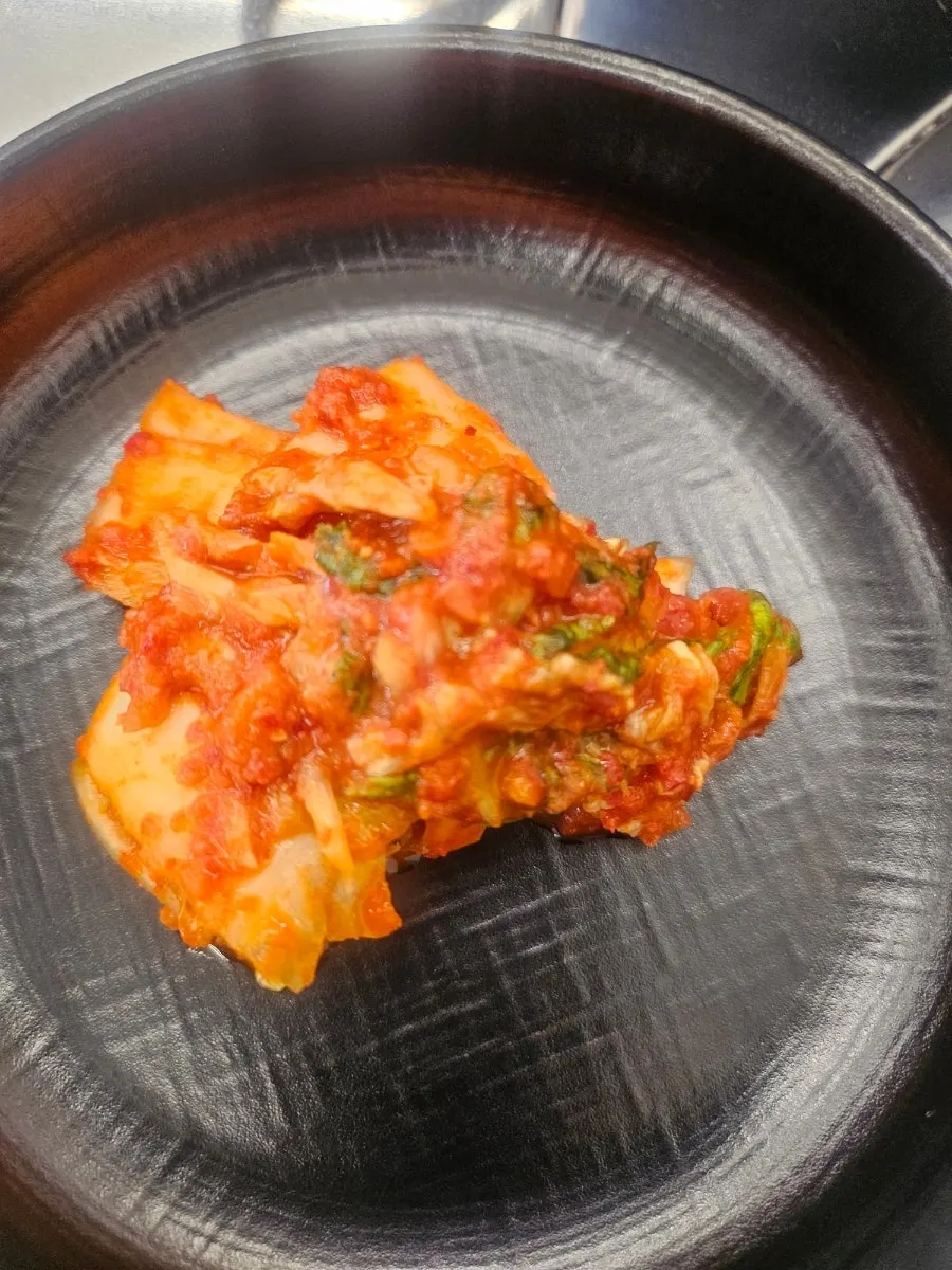 Cabbage kimchi and kkakdugi in stainless trays