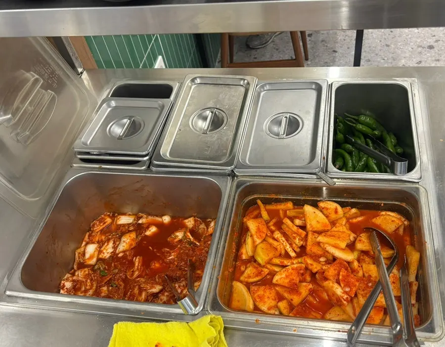 Self-serve side dish bar toward the back of the restaurant