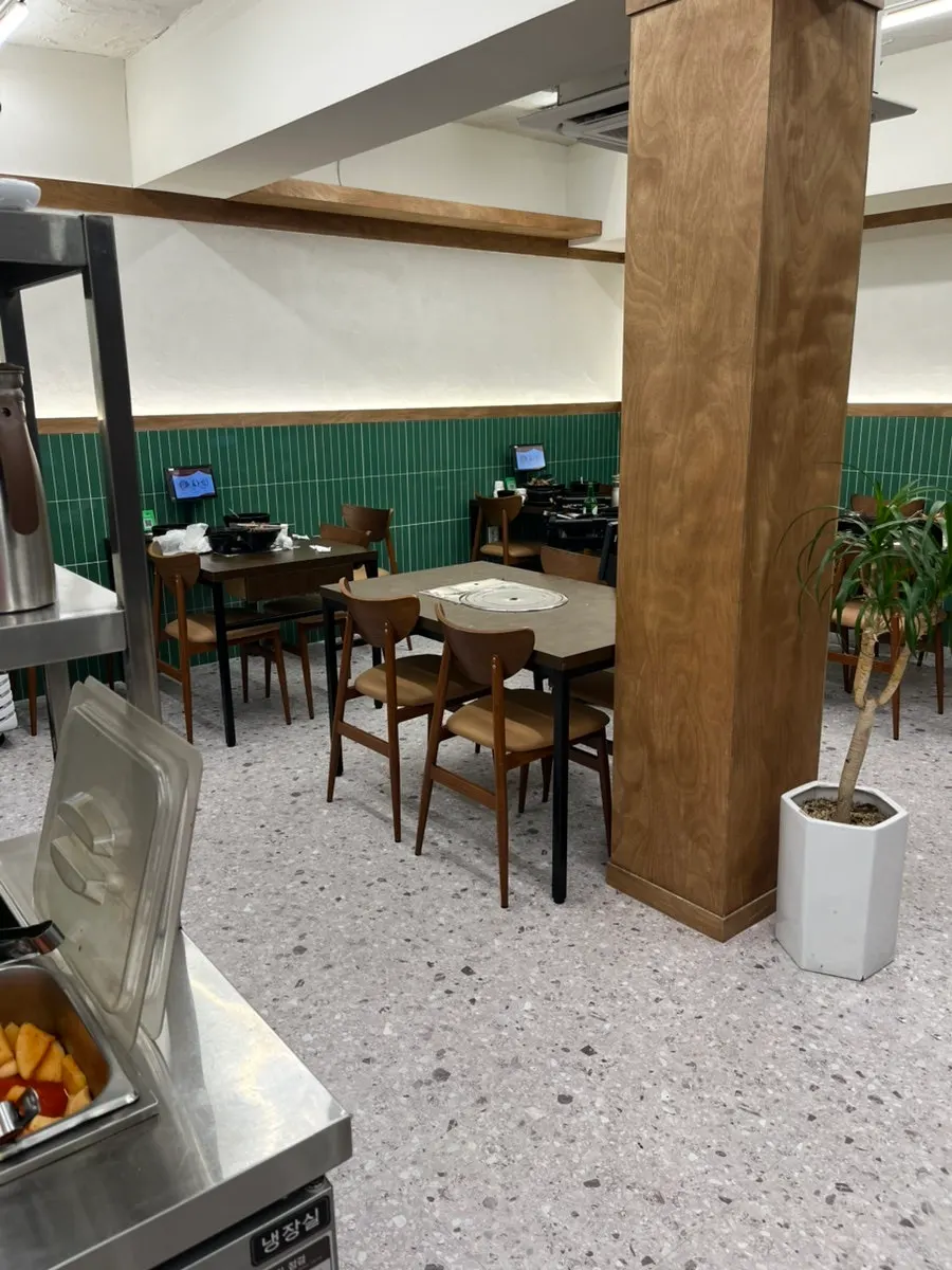 Interior of Samsol Gamjatang Main Branch, busy with family customers