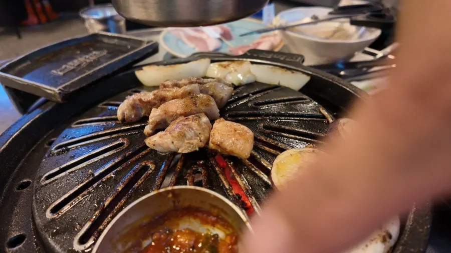 A golden-brown grilled piece of pork belly