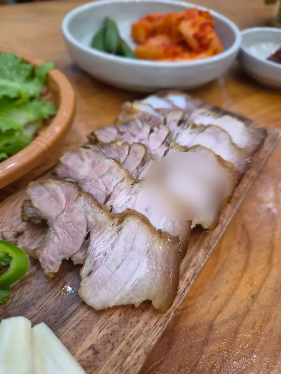 Table spread with haejangguk and dombe pork together