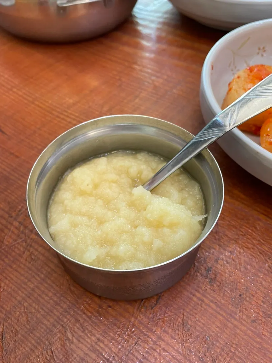 Meat scooped up with a spoon from the haejangguk