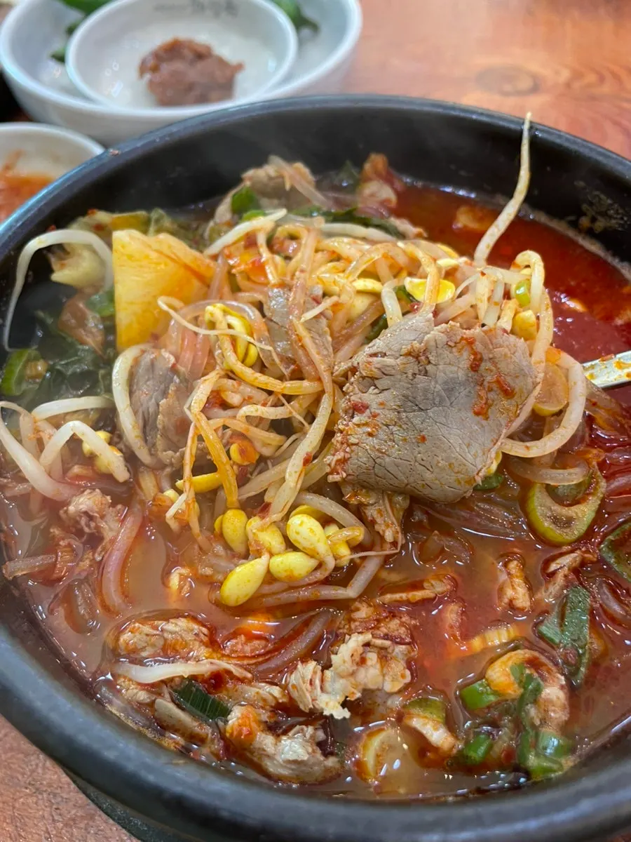 Close-up of the spicy broth mixed with chili paste