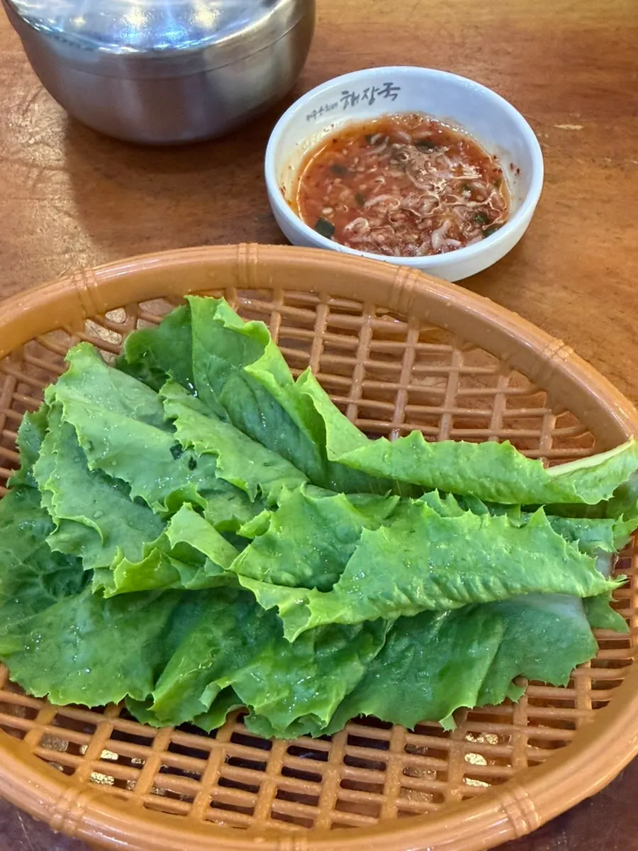 Table with dombe pork and basic side dishes