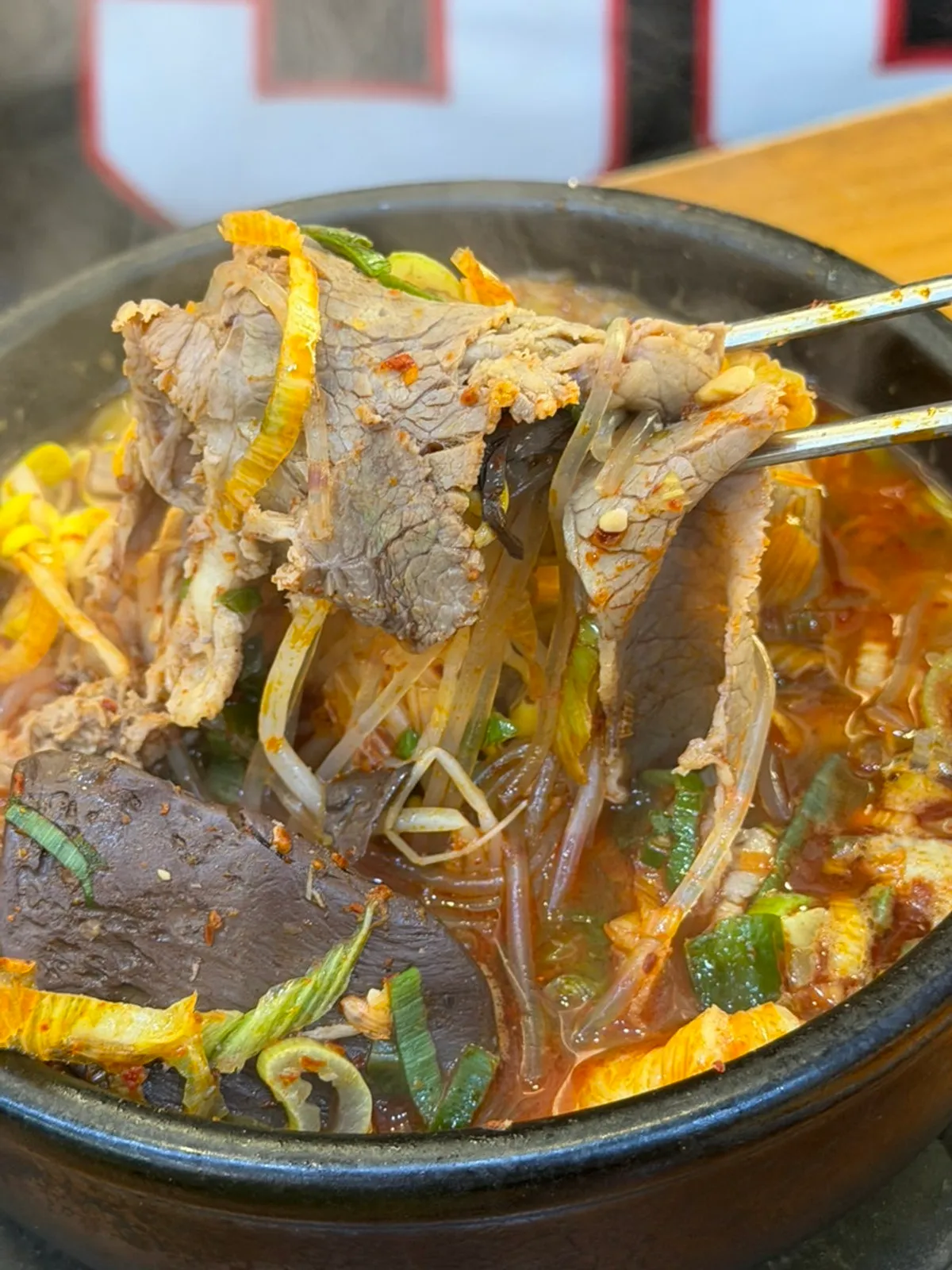 Jeju-style haejangguk full of broth and ingredients