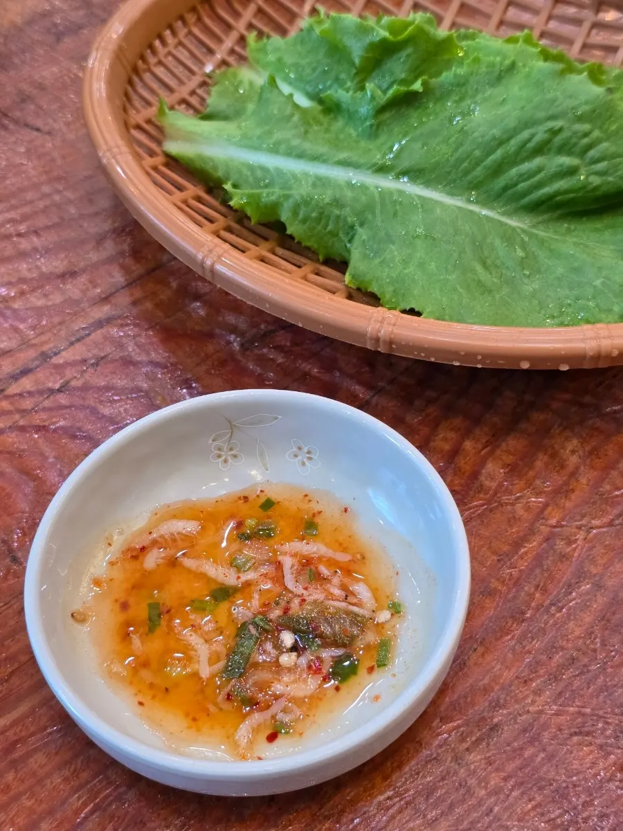 Container and plate of seokbakji (diced radish kimchi)