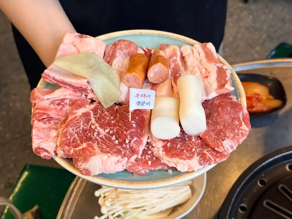A glass of somaek paired with the meat