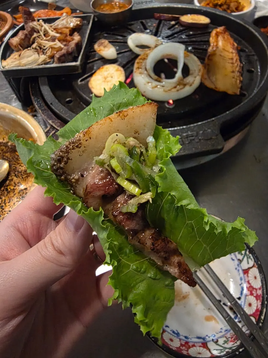 Kkodeulsal in a lettuce wrap