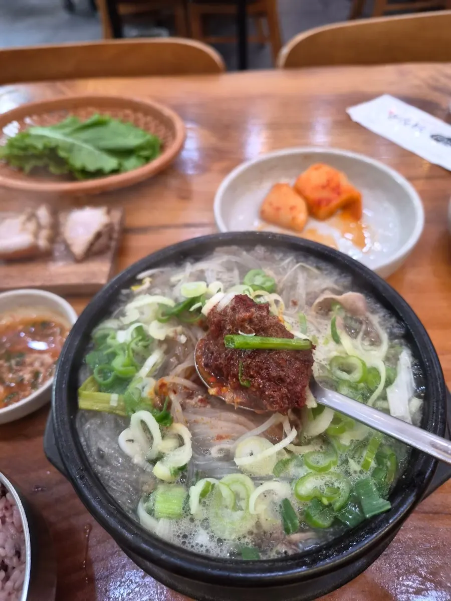Haejangguk broth topped with red dadaegi