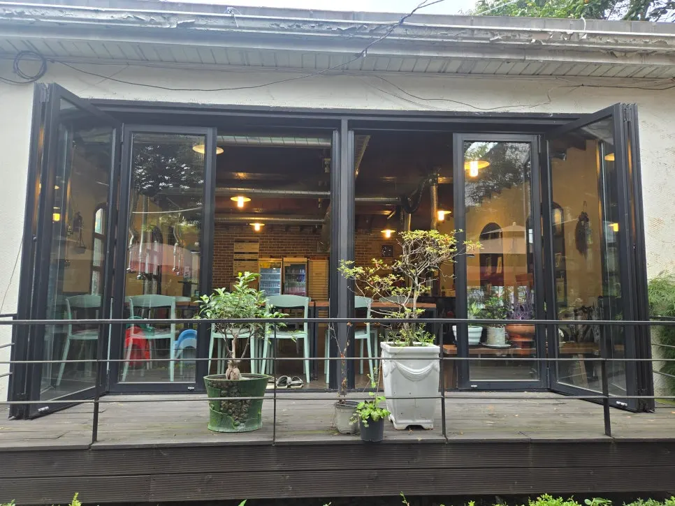 View of the indoor dining space's folding doors from outside