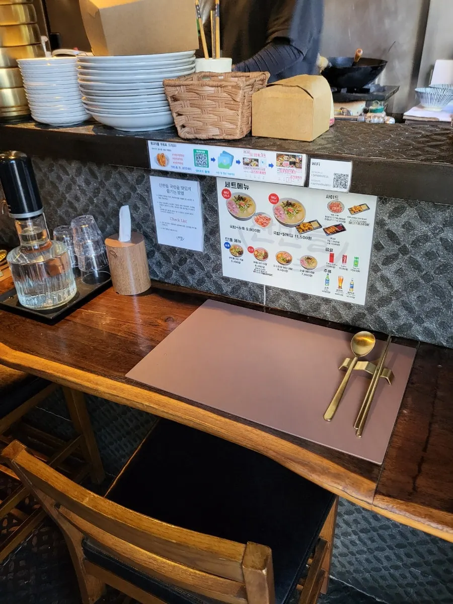 Individually set counter seating at Sanbandeul Pork Gukbap