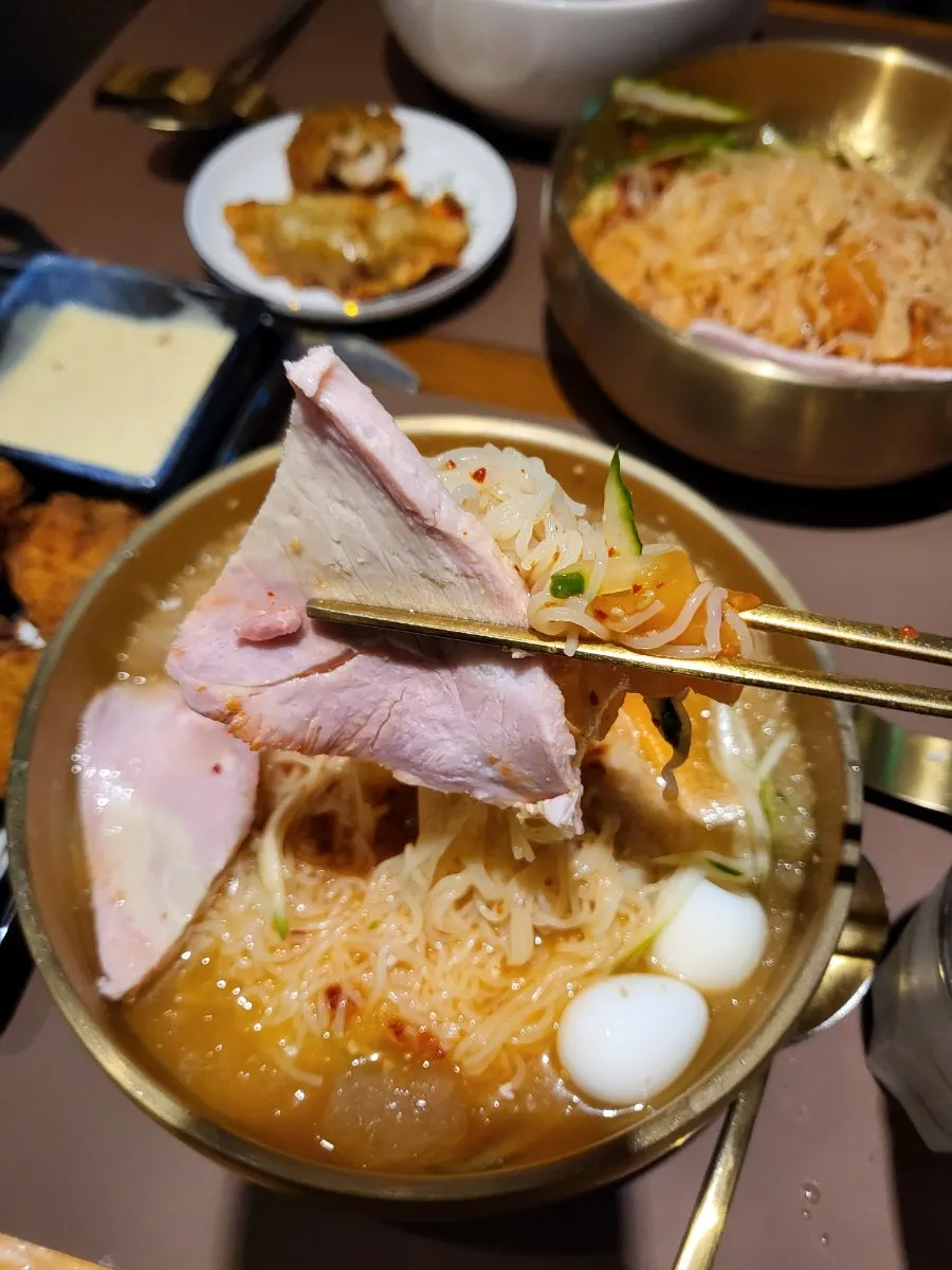 Thick-cut pork on top of the milmyeon