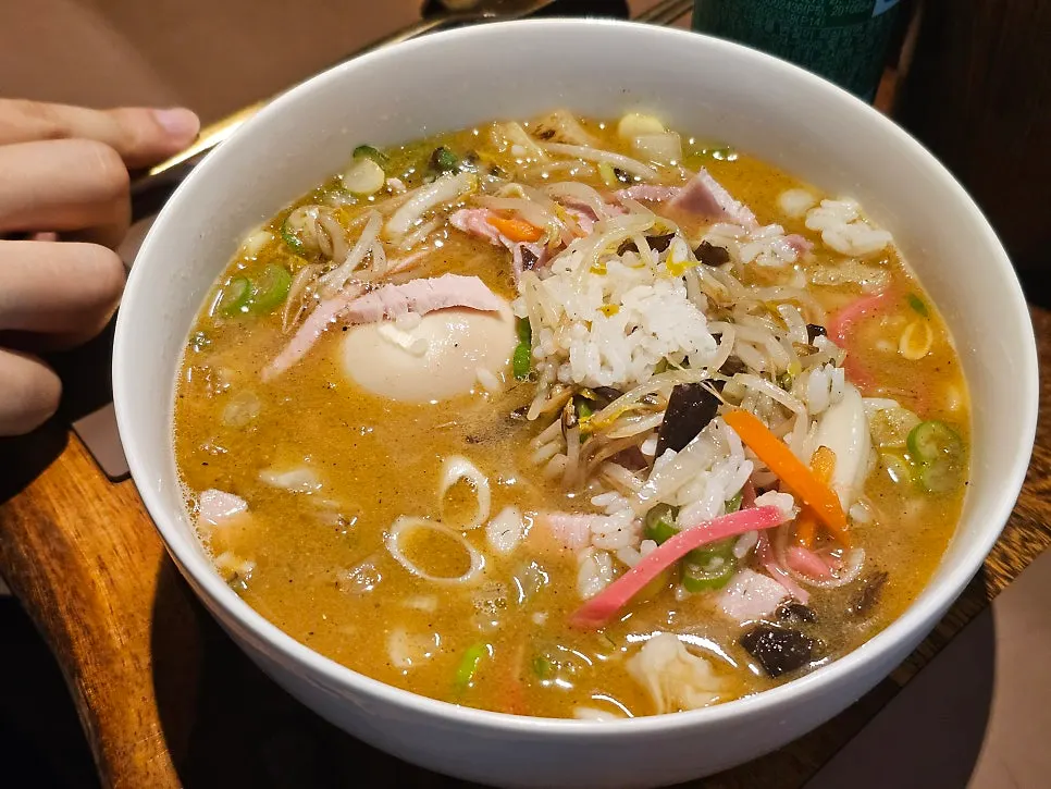 The salty, rich broth of Sanbandeul gukbap