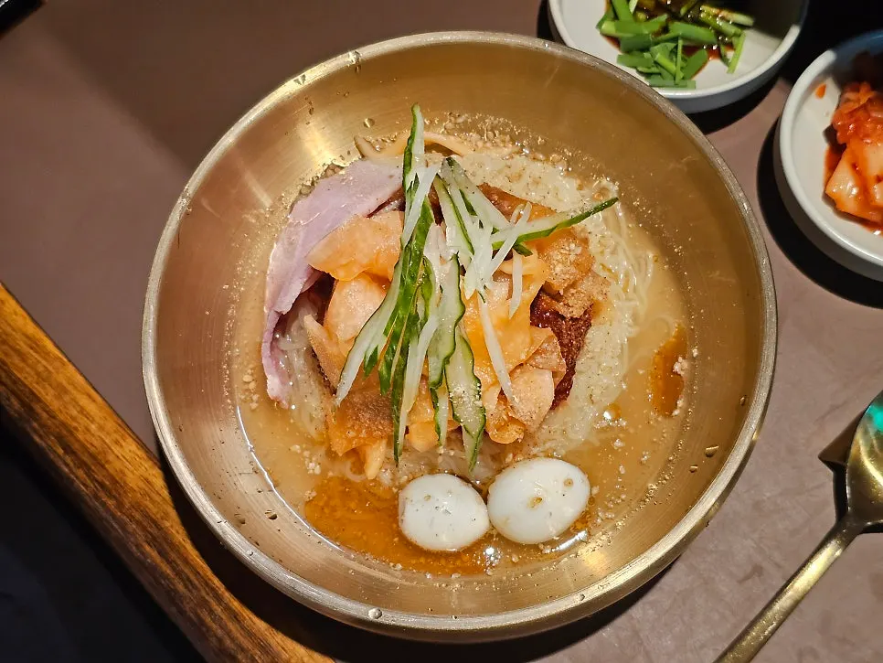 A solo meal of gukbap and milmyeon at the bar seats