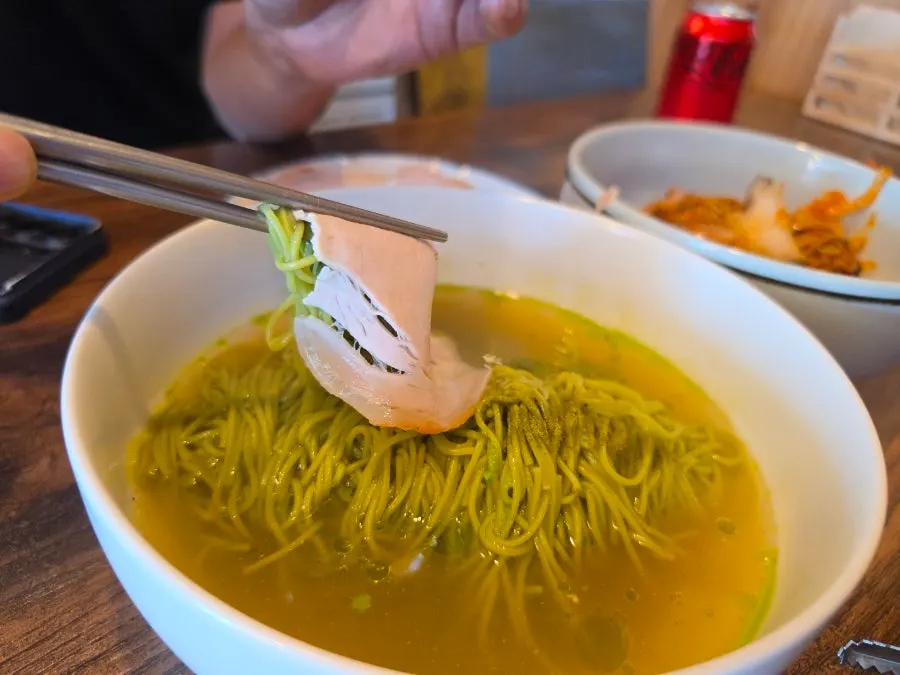 Table set with matcha onmyeon and abalone jang bibim naengmyeon together