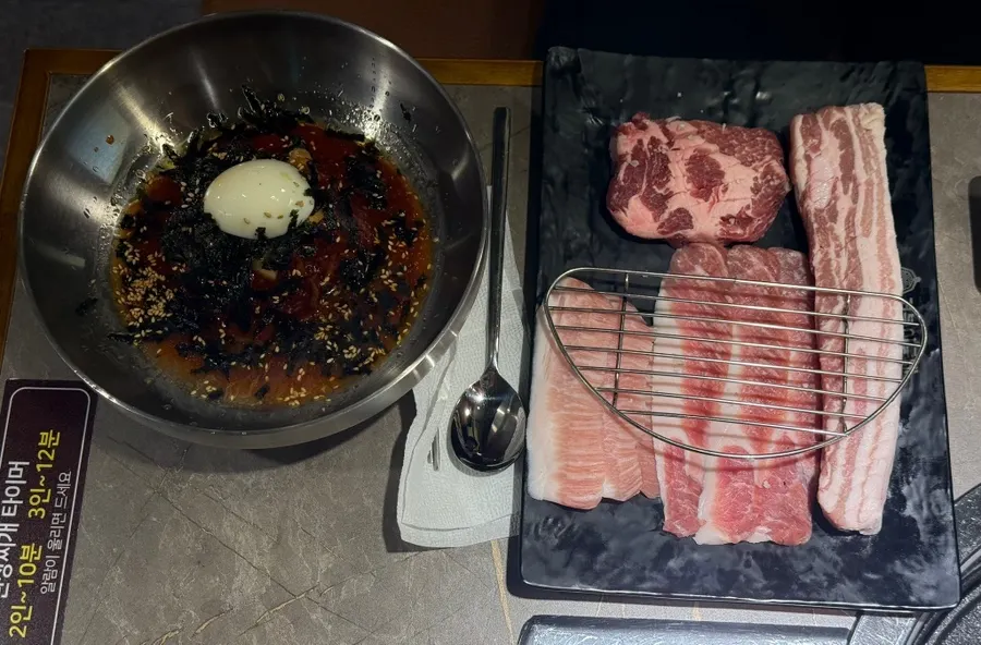 Plate of raw aged pork belly for the couple set