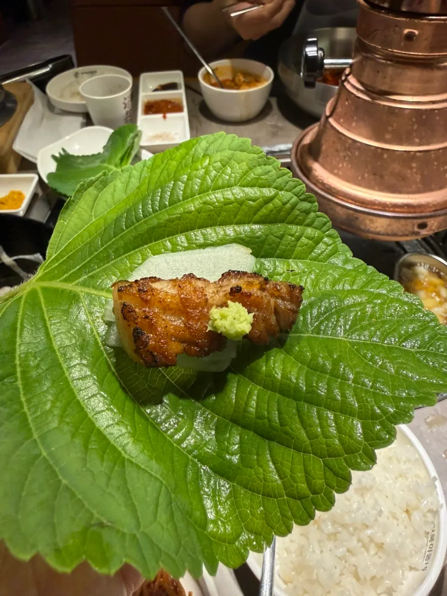 A wrap with scallions and grilled mushrooms