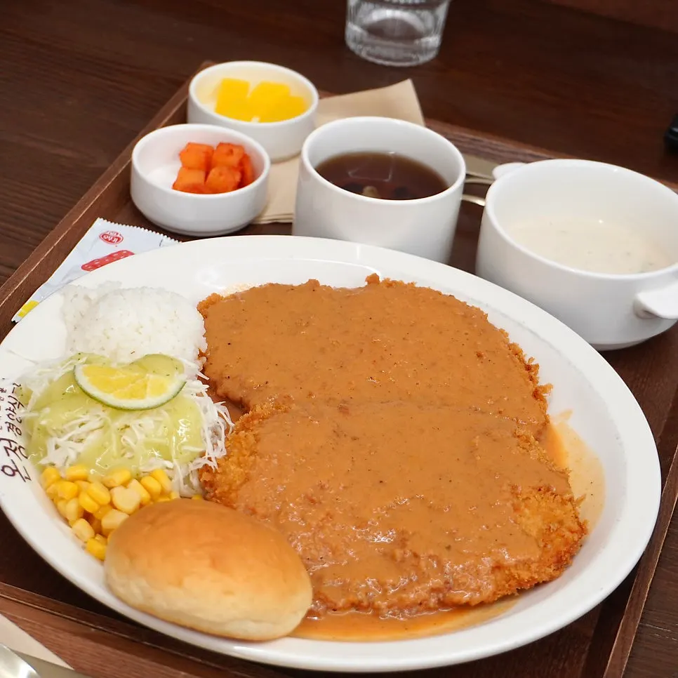 Self-serve bar with water, rice, and side dishes