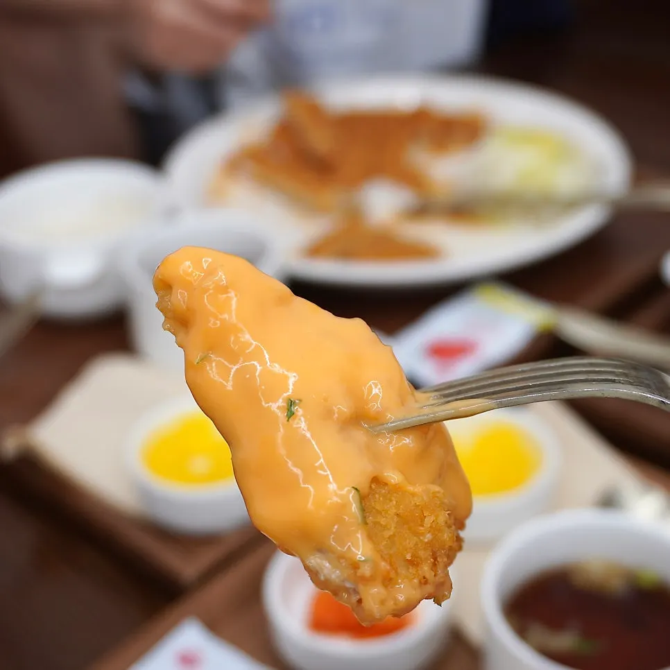 Close-up of the spicy sauce on the pork cutlet