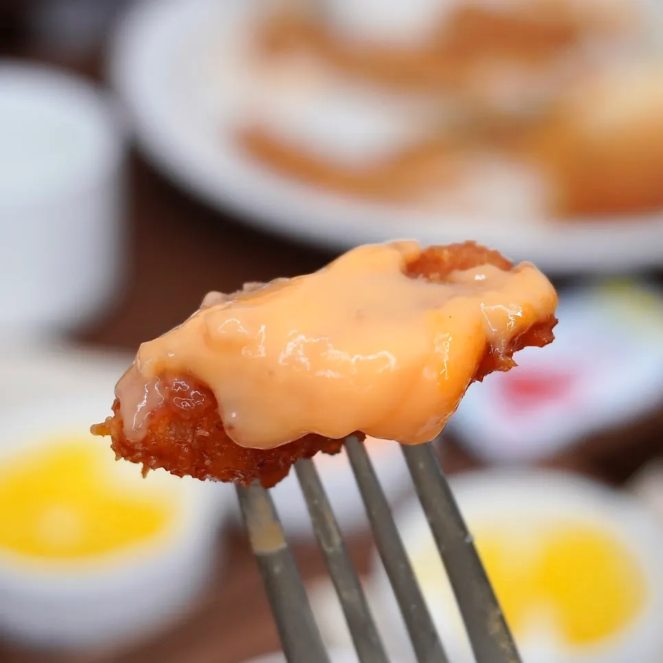 Cheddar cheese pork cutlet with melted yellow cheese