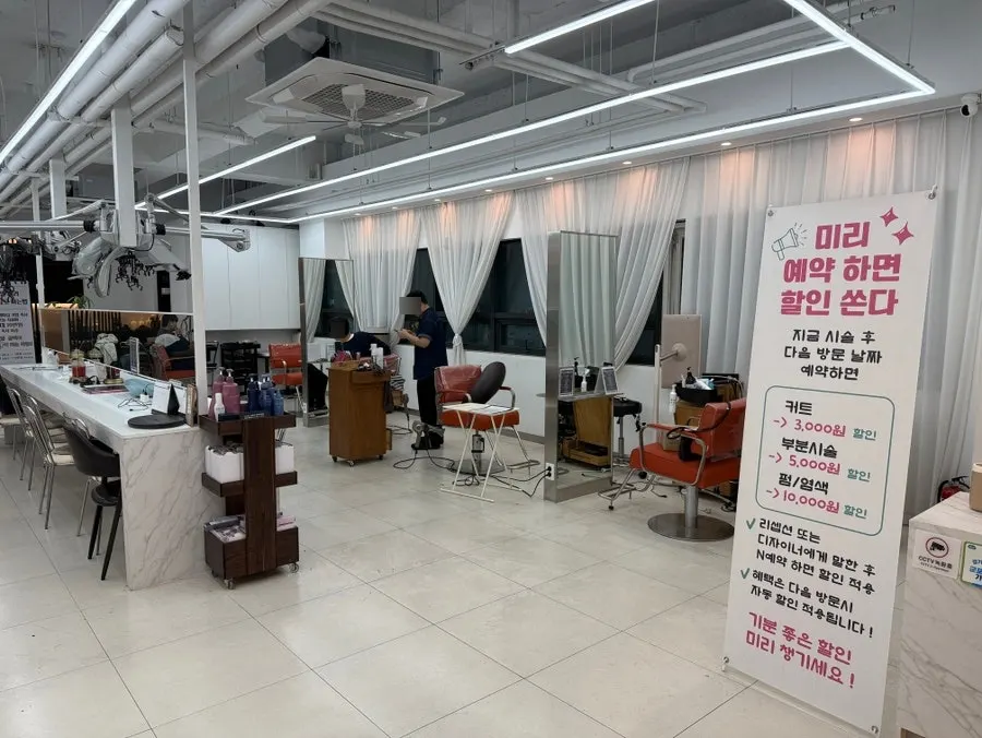 Row of styling chairs inside the salon
