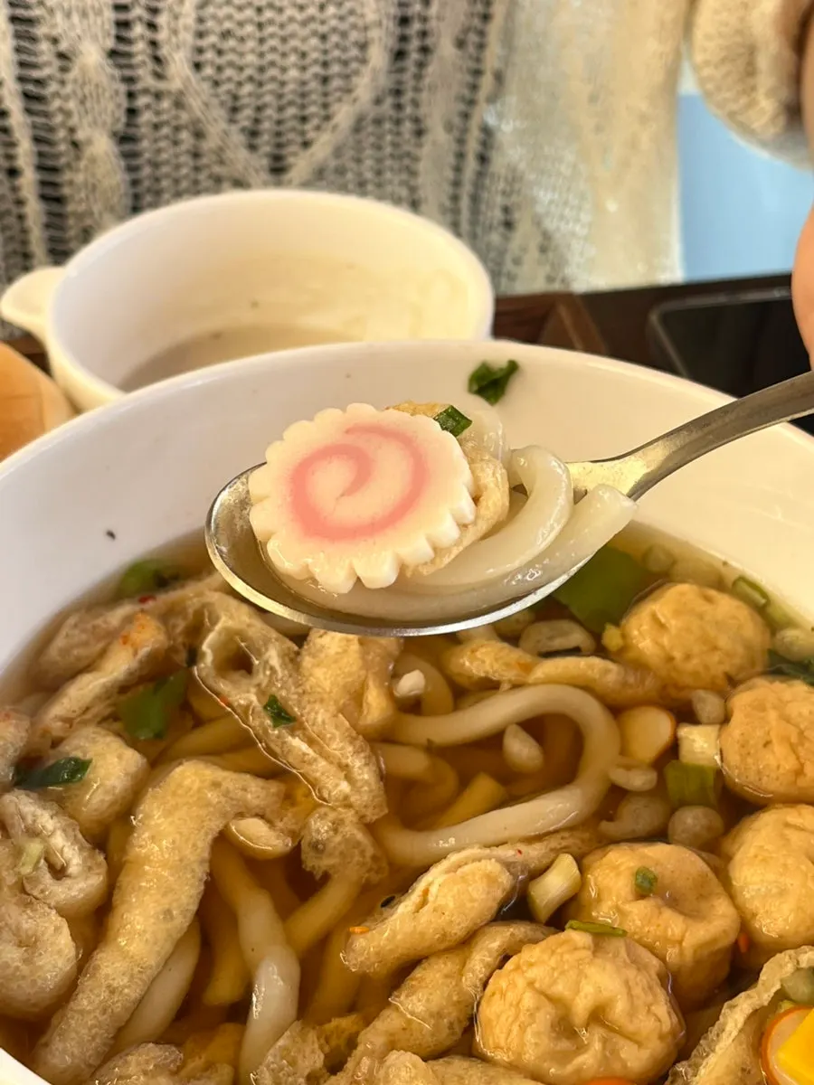Warm soup served alongside pork cutlet