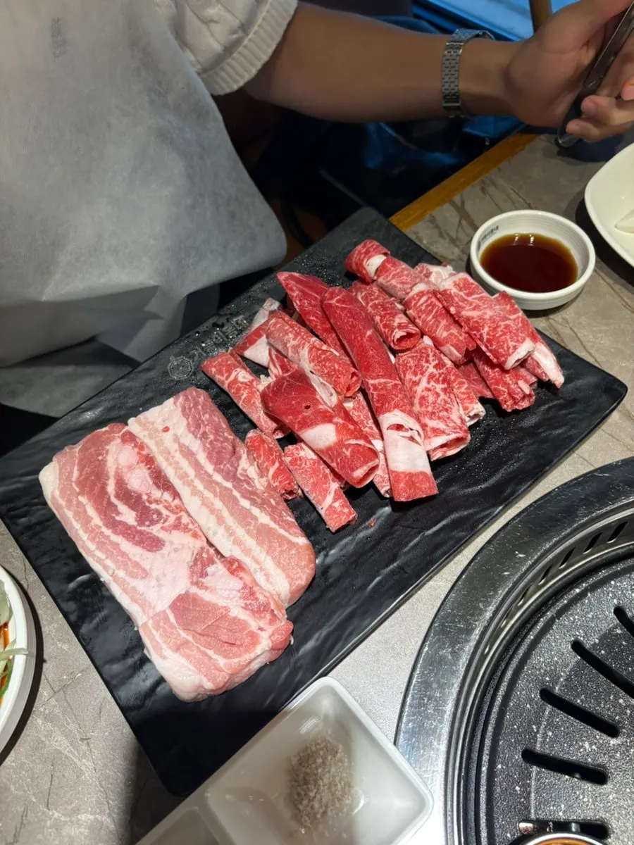 Shabu-shabu pot and grill pan on the two table burners