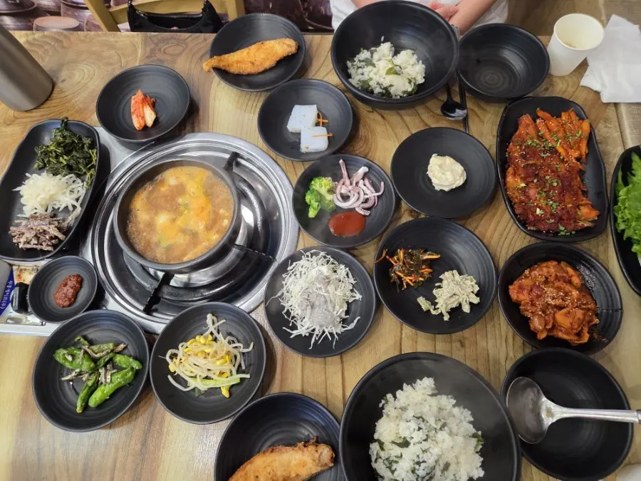 Banchan spread set out before the rice arrives