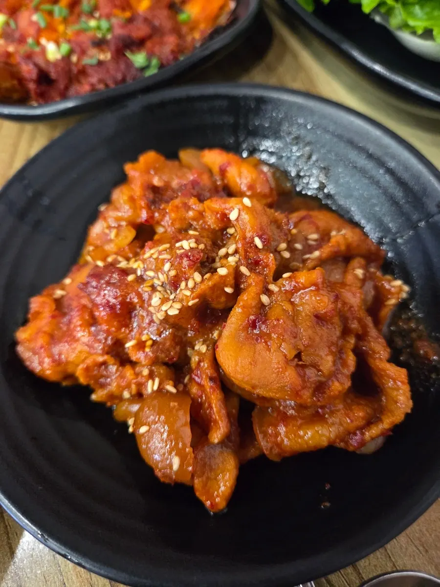 Sweet and spicy jeyuk-bokkeum sprinkled with sesame seeds