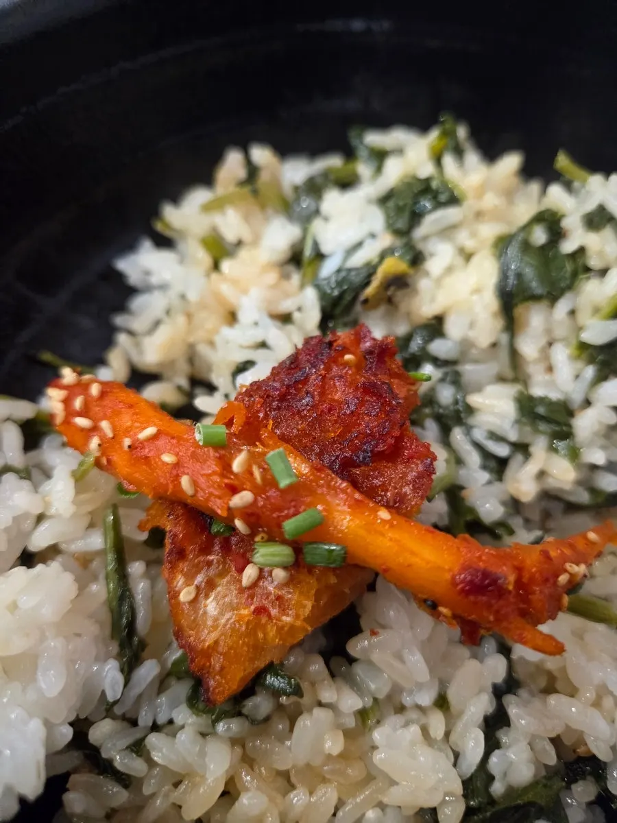 Gondre cauldron rice scooped into a bowl