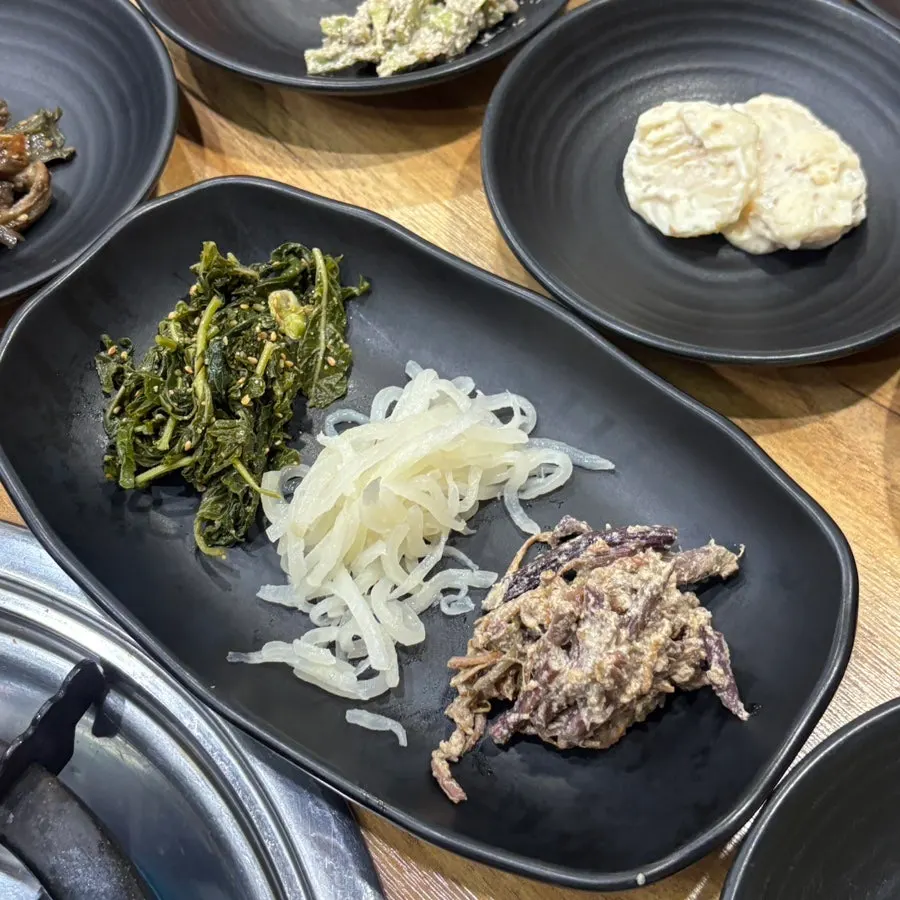 Plate of seasoned vegetable side dishes and stir-fried zucchini
