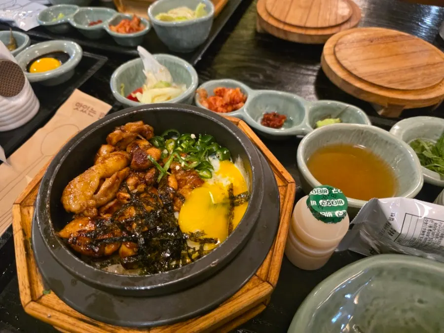 Inside of cheese dakgalbi pot rice with melted cheese