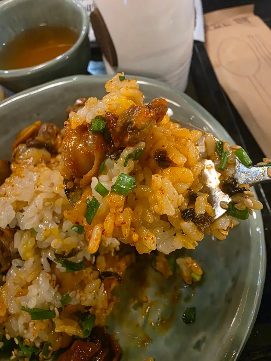 Cockle bibimbap scooped onto a small plate