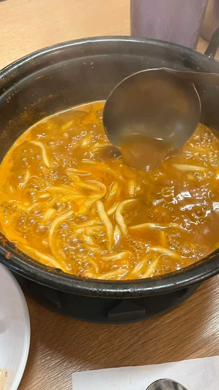 Kalguksu noodles cooking with refilled broth